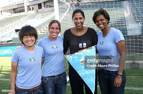 Los Angeles Sol players Aya Miyama, Camille Abily and Karina Le Blanc pose with president of the FIFA Women's World Cup Organizing Committee Steffi...