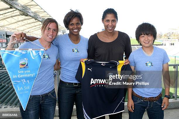 Los Angeles Sol players Camille Abily, Karina LeBlanc, and Aya Miyama pose with president of the FIFA Women's World Cup Organizing Committee Steffi...