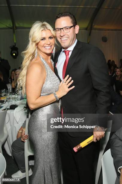 Timothy Sykes poses with a contest winner at the Pencils of Promise Annual Gala 2017 in Central Park on December 7, 2017 in New York City.