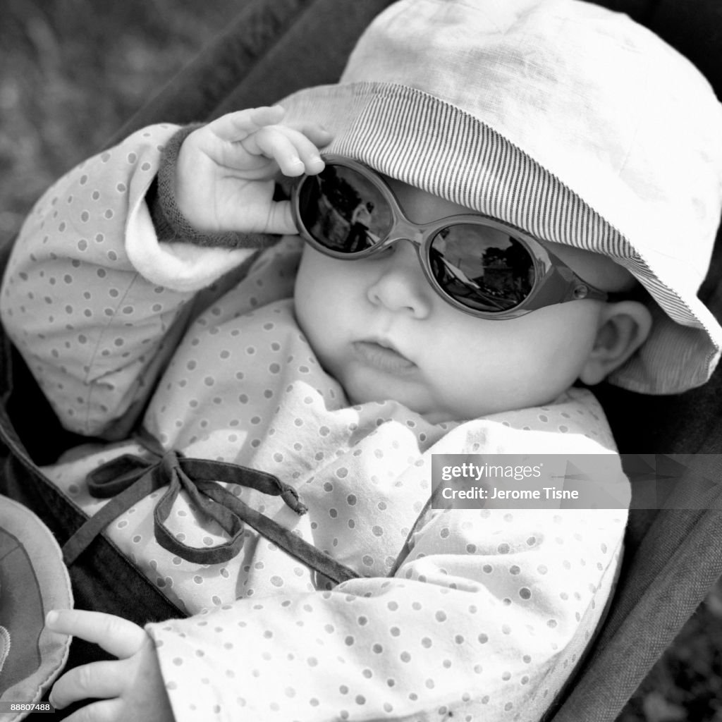 Six month old baby girl with sun glasses