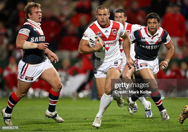 Matt Cooper of the Dragons makes a break during the round 17 NRL match between the St George Illawarra Dragons and the Sydney Roosters at WIN Jubilee...