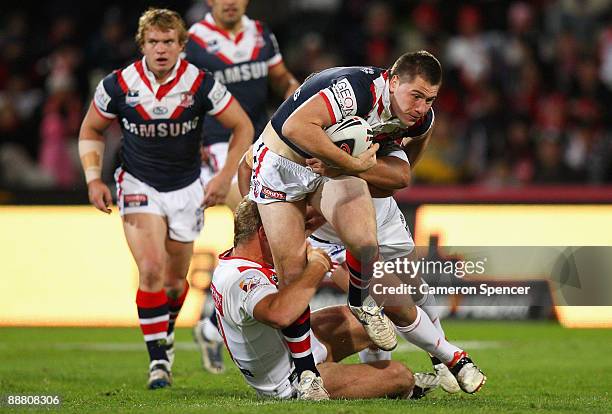 Shaun Kenny-Dowall of the Roosters makes a break during the round 17 NRL match between the St George Illawarra Dragons and the Sydney Roosters at WIN...