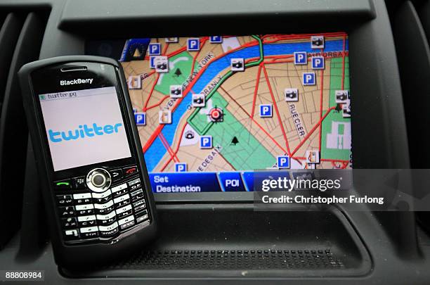 In this photograph illustration a Blackberry, logged onto social networking site Twitter, sits on a car dashboard on July 3, 2009 in Manchester,...