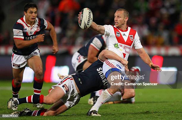 Ben Hornby of the Dragons is tackled during the round 17 NRL match between the St George Illawarra Dragons and the Sydney Roosters at WIN Jubilee...