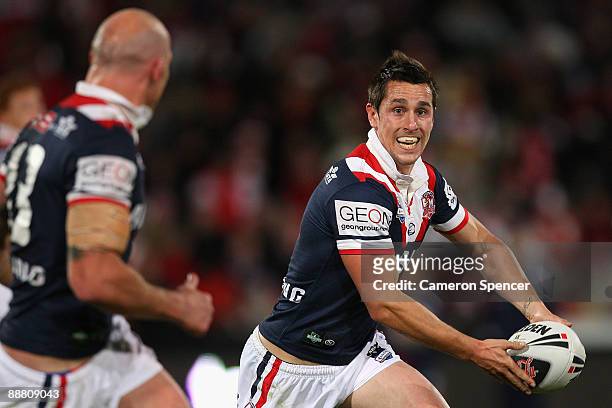 Mitchell Pearce of the Roosters passes the ball during the round 17 NRL match between the St George Illawarra Dragons and the Sydney Roosters at WIN...
