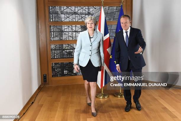 British Prime Minister Theresa May and European Council President Donald Tusk leave after posing for photographers at the European Council in...