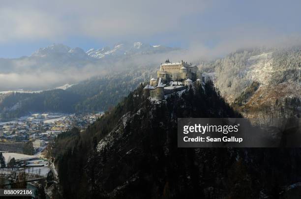 Hohenwerfen Castle stands on a crisp, winter morning under a mountain of the Berchtesgaden Alps among trees brushed with snow on December 7, 2017...