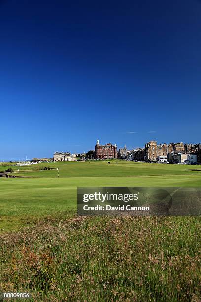 View of the 1st green with the Royal and Ancient Golf Club of St Andrews Clubhouse with the 1st fairway and the par 4, 18th hole on the Old Course on...