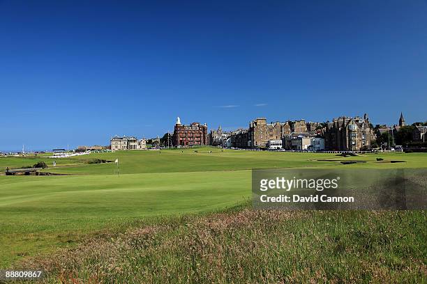 View of the 1st green with the Royal and Ancient Golf Club of St Andrews Clubhouse with the 1st fairway and the par 4, 18th hole on the Old Course on...