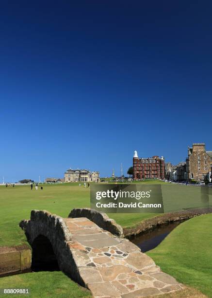 View of the par 4 18th hole with the Royal and Ancient Golf Club of St Andrews Clubhouse and the Swilcan Bridge on the Old Course on July 2, 2009 in...