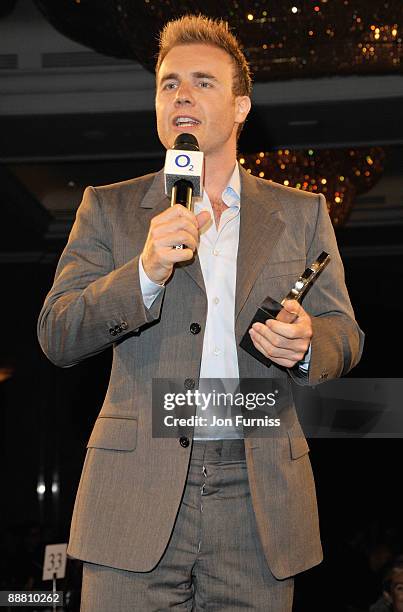 Singer Gary Barlow from Take That with their O2 Silver Clef award during the O2 Silver Clef Awards 2009 at the London Hilton on July 3, 2009 in...