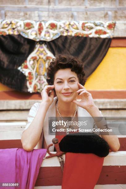 American actress Ava Gardner as Lady Brett Ashley in 'The Sun Also Rises', 1957. She is standing in a bullring with a matador's cape, hat and sword.