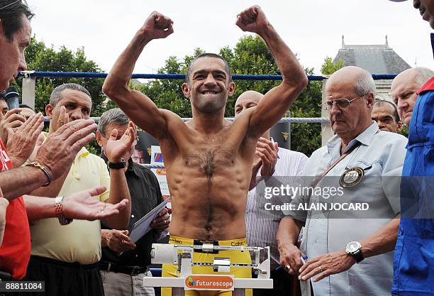 French former super-bantamweight WBA champion Mahyar Monshipour gestures as he weighs-in on July 3, 2009 in Poitiers, central France, on the eve of...