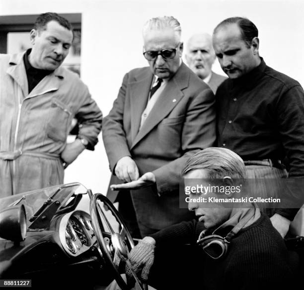 Before The Mille Miglia; Maranello, May 1957. Peter Collins has just been out testing his new Ferrari 335 Sport and is actually discussing the design...