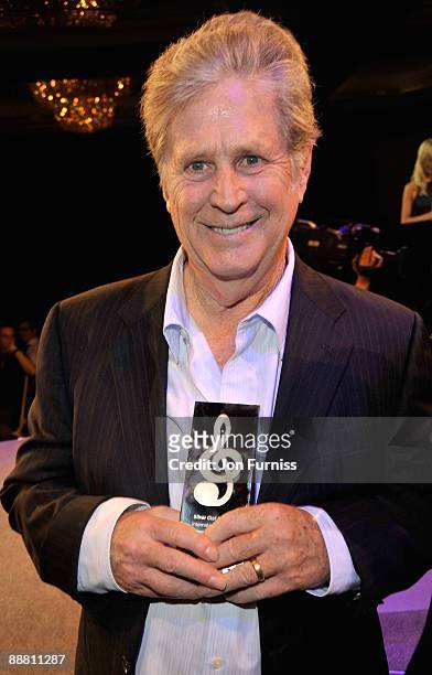 Musician Brian Wilson from the Beach Boys with his award for Best International Act during the O2 Silver Clef Awards 2009 at the London Hilton on...
