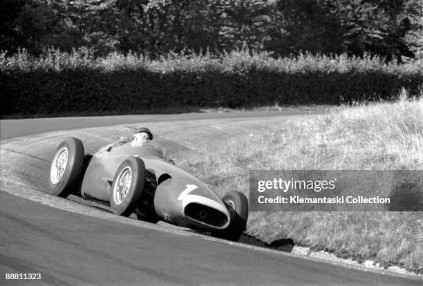 The German Grand Prix; Nürburgring, August 4, 1957. Juan Manuel Fangio in the Karussel during his epic pursuit of Hawthorn and Collins.