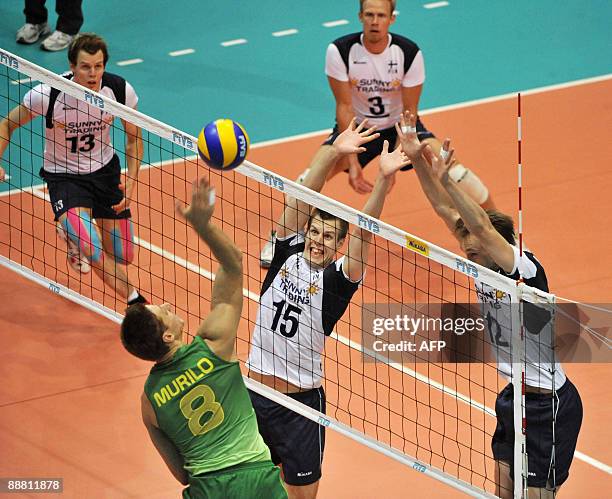 Finland's Matti Oivanen and Olli Kunnari try to block in front of Brazil's Murillo Endres while Mikko Oivanen and Mikko Esko follow in the background...