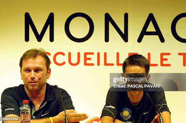 Tour de France winner and Kazakh cycling team Astana 's leader Alberto Contador of Spain , flanked by his manager Johan Bruyneel, attends a press...