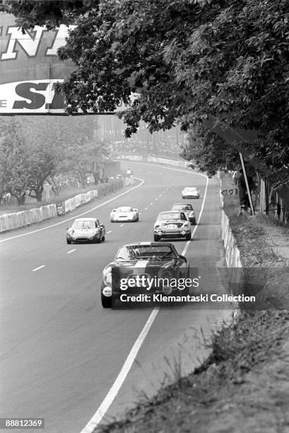 The Le Mans 24 Hours; Le Mans, June 14-15, 1969. The Ferrari 275GTB/C driven by Jacques Rey and Clause Haldi brakes for Tertre Rouge. They were...