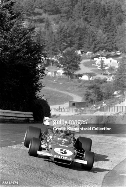 The German Grand Prix; Nürburgring, August 1, 1971. The silver helmet identifies Mario Andretti as he drives his Ferrari 312B/F1 into the Karussel....