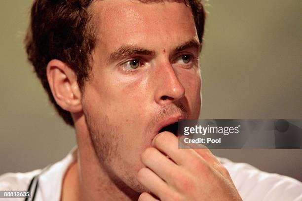 Andy Murray of Great Britain attends a press conference after defeat during the men's singles semi final match against Andy Roddick of USA on Day...