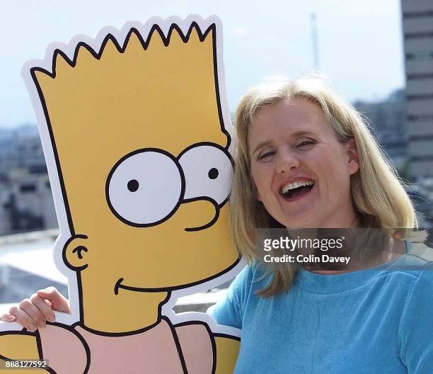 The voices behind The Simpsons, Nancy Cartwright with cutout of Bart Simpson, London, 16th August 2000.
