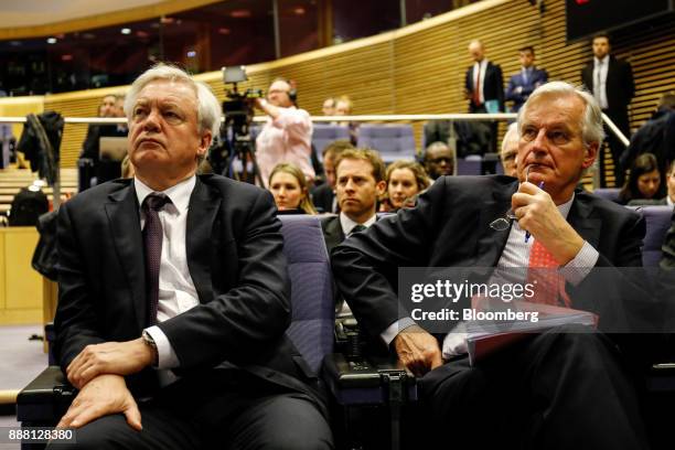 David Davis, U.K. Exiting the European Union secretary, left, and Michel Barnier, chief negotiator for the European Union , right, sit in the...
