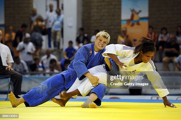 Irene Chevreuil of France and Urska Zolnir of Slovenia compete in the women's 63Kg Judo final event of the XVI Mediterranean Games at the Febo sports...