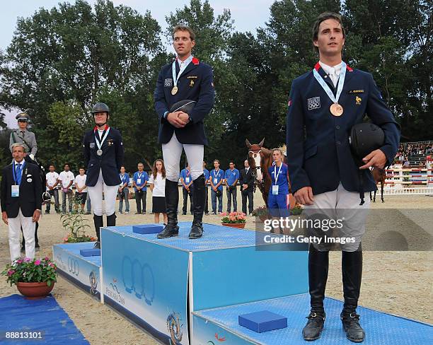 Silver medalist Alexandra Francart on her horse Rush D'Hoogpoort, gold medalist Simon Delestre on his horse Melodie Ardente and Julien Gonin on his...