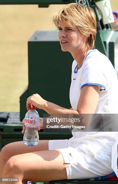 Samantha Smith of Great Britain takes a break whilst playing with Annabel Croft of Great Britain during the women's doubles invitation match against...