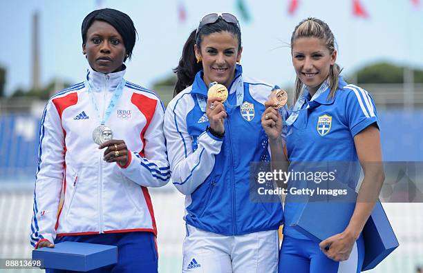 Silver medalist Teresa Nzola Meso Ba of France, gold medalist Athanasia Perra and bronze medalist Paraskevi Papachristou of Greece pose for the...