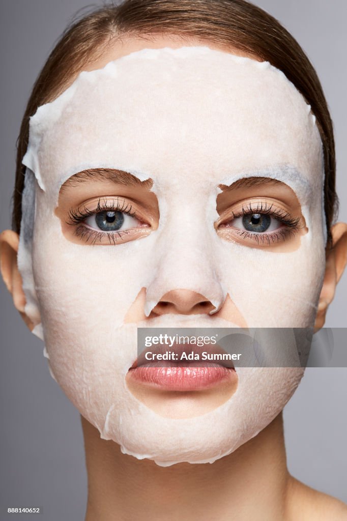 Woman wearing a moisturizing sheet mask