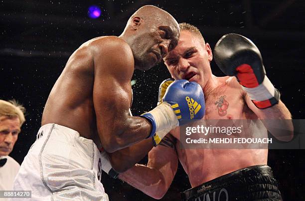 French Souleymane Mbaye vies British Colin Lynes during their light-welterweight European boxing championships fight, on July 3, 2009 at the Marcel...