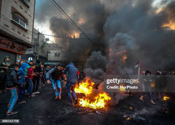 Palestinians refugees attend a protest against the US President decision to recognize Jerusalem as the capital of Israel, in Jabaliya refugee camp,...