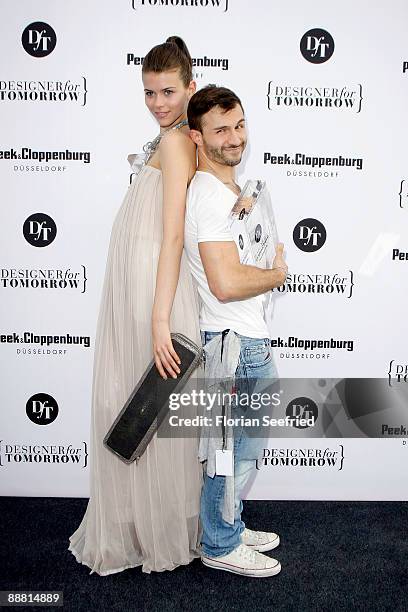 Designer and winner Sam Frenzel and model attend the aftershow reception of the Award 'Designer for Tomorrow by Peek & Cloppenburg Duesseldorf'...