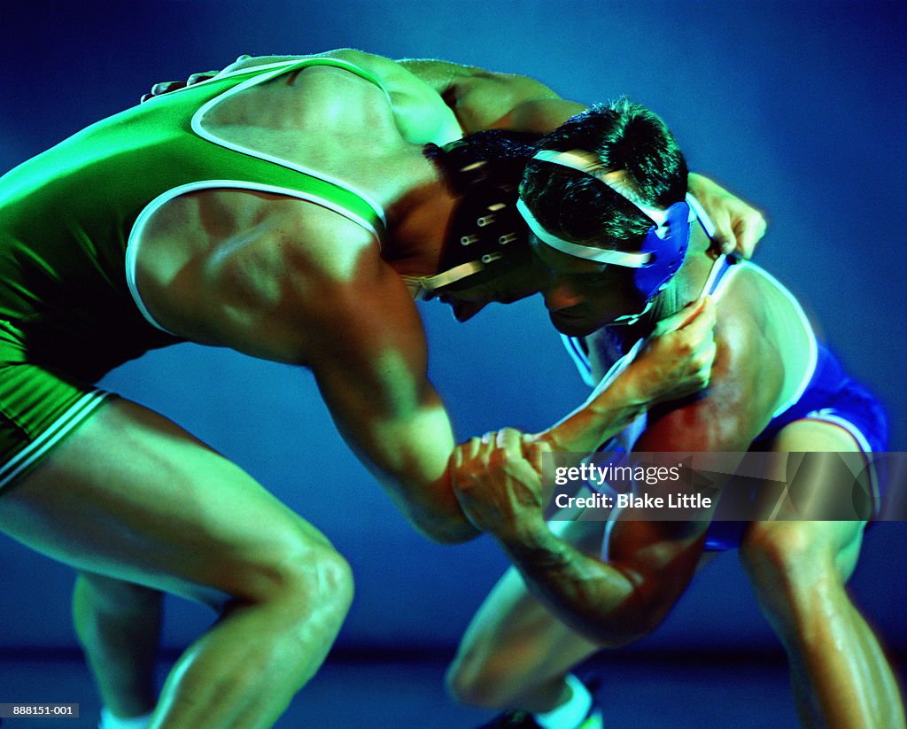 Two wrestlers grappling during competition (Digital Enhancement)