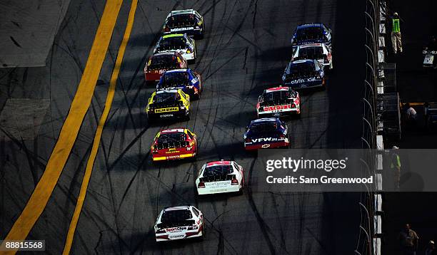 Clint Bowyer, driver of the Holiday Inn Chevrolet, leads the field during the NASCAR Nationwide Series Subway Jalapeno 250 at Daytona International...