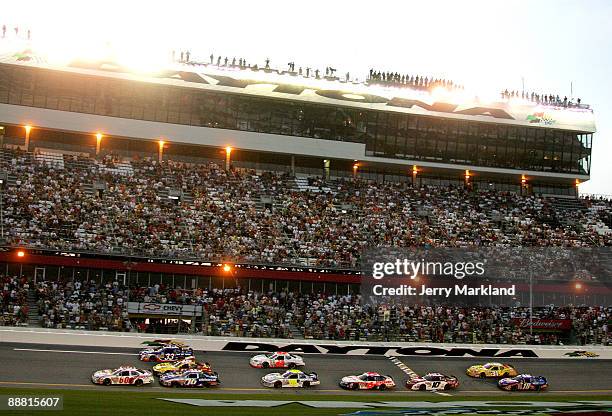 Carl Edwards, driver of the Save-a-Lot Ford, leads a group of cars during the NASCAR Nationwide Series Subway Jalapeno 250 at Daytona International...