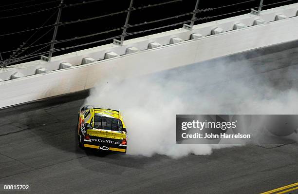 Chase Austin, driver of the Cavi Clothing/Macy's Chevrolet, loses control during the NASCAR Nationwide Series Subway Jalapeno 250 at Daytona...