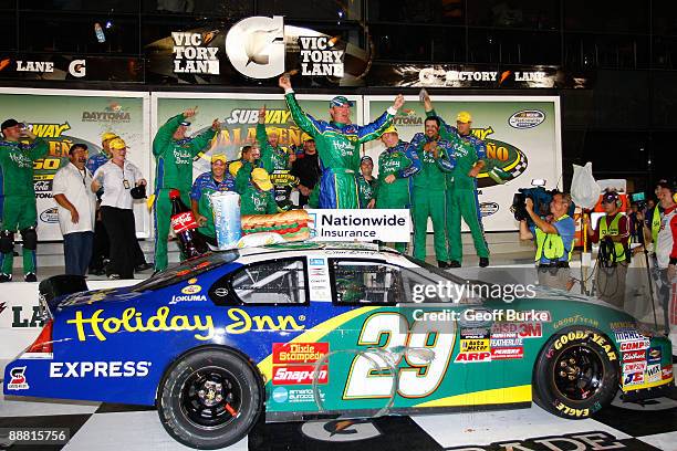 Clint Bowyer, driver of the Holiday Inn Chevrolet, celebrates in victory lane after winning the NASCAR Nationwide Series Subway Jalapeno 250 at...