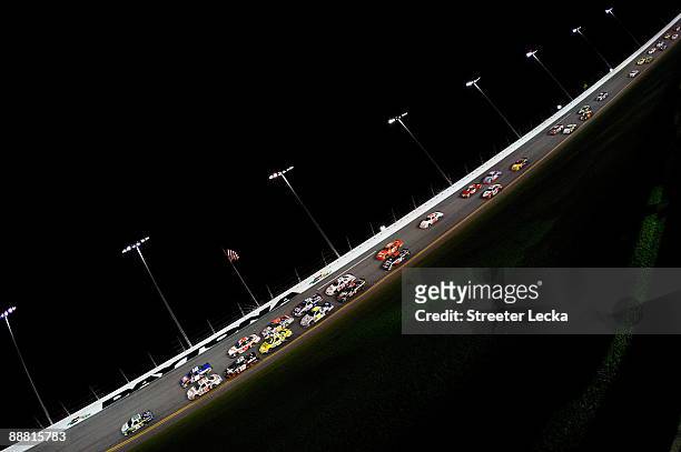 Clint Bowyer, driver of the Holliday Inn Chevrolet, leads a pack of cars during the NASCAR Nationwide Series Subway Jalapeno 250 at Daytona...