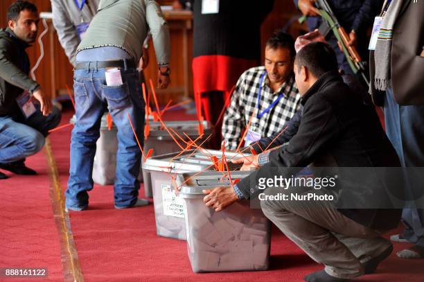 Staffs of Nepal Election commissioner preparing to broke the seal on ballot box to count the votes, a day after Nepalese people casts their vote in...