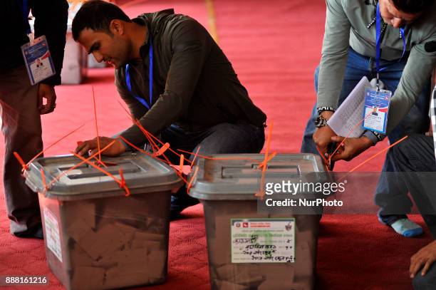 Staffs of Nepal Election commissioner preparing to broke the seal on ballot box to count the votes, a day after Nepalese people casts their vote in...