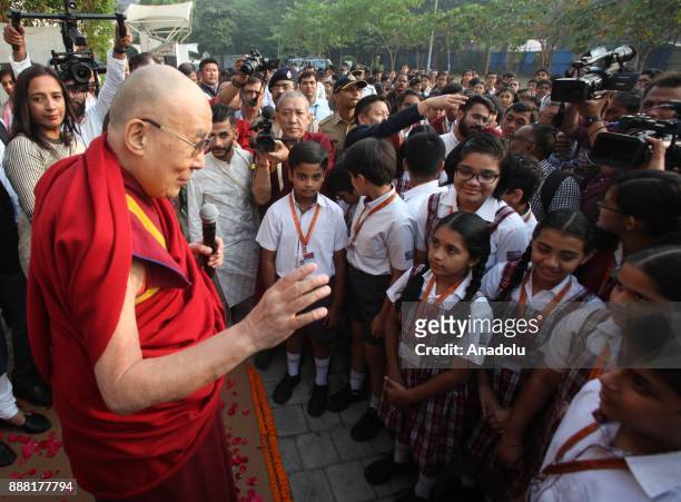 Tibetan spiritual leader, the Dalai Lama, speaks to students in Mumbai, India, December 8, 2017.