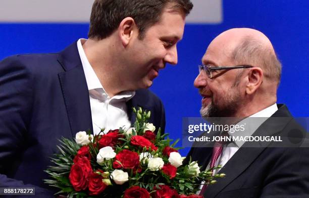 Newly elected general secretary of the Social Democratic Party Lars Klingbeil receives a bouquet from leader of the Social Democratic Party , Martin...