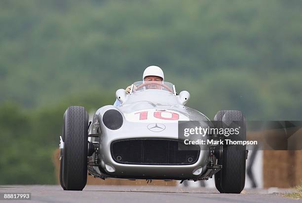 Sir Stirling Moss drives the 1954 Mercedes Benz during day two of the Goodwood Festival of Speed at the Goodwood Estate on July 4, 2009 in...