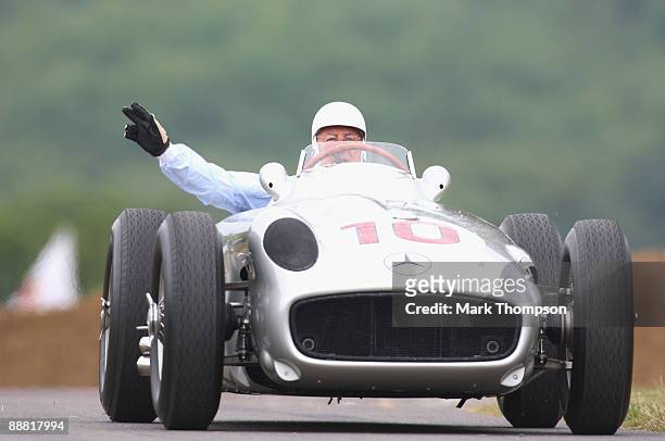 Sir Stirling Moss drives the 1954 Mercedes Benz during day two of the Goodwood Festival of Speed at the Goodwood Estate on July 4, 2009 in...