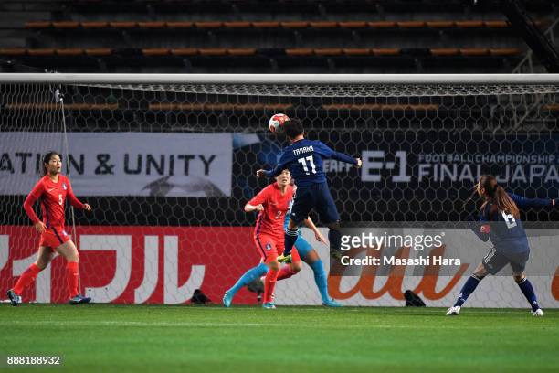 Mina Tanaka of Japan heads the ball to score the opening goal during the EAFF E-1 Women's Football Championship between Japan and South Korea at...