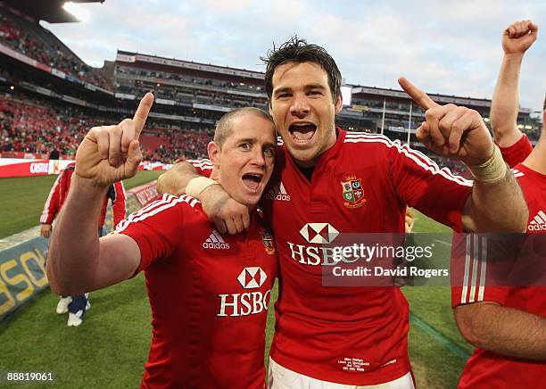 Shane Williams celebrates with team mate Mike Phillips after their victory in the Third Test match between South African and the British and Irish...