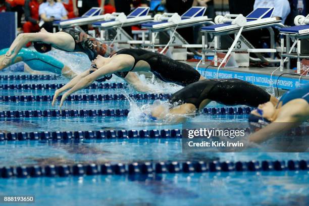 Luka Szynal of Firestone Akron Swim Team pushes off of the wall during the start of the C-Final of the women's 100 yard backstroke during day 3 of...